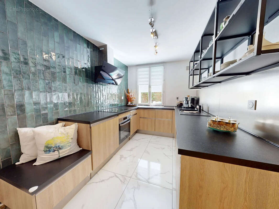 Gagny centre ,une maison familiale rénovée où chaque espace a été pensé pour le quotidien - photo 4