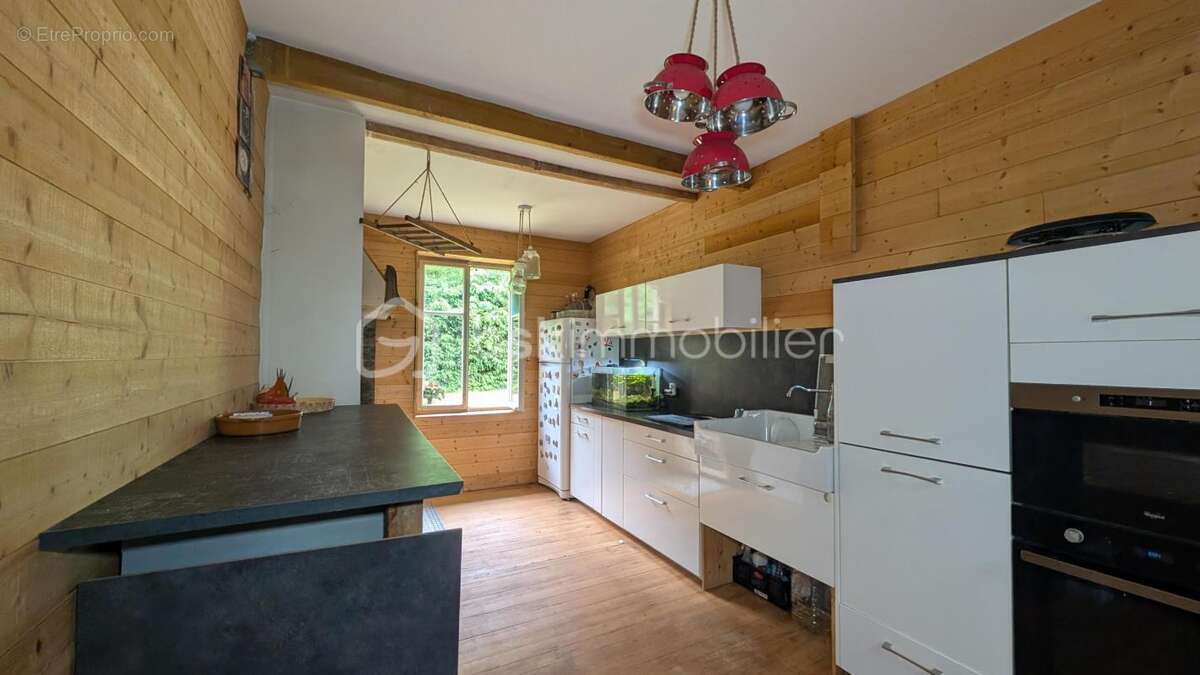 Maison 130m² - 3 chambres - 2 salles de bain - 2 garages sur 23 ares - photo 4