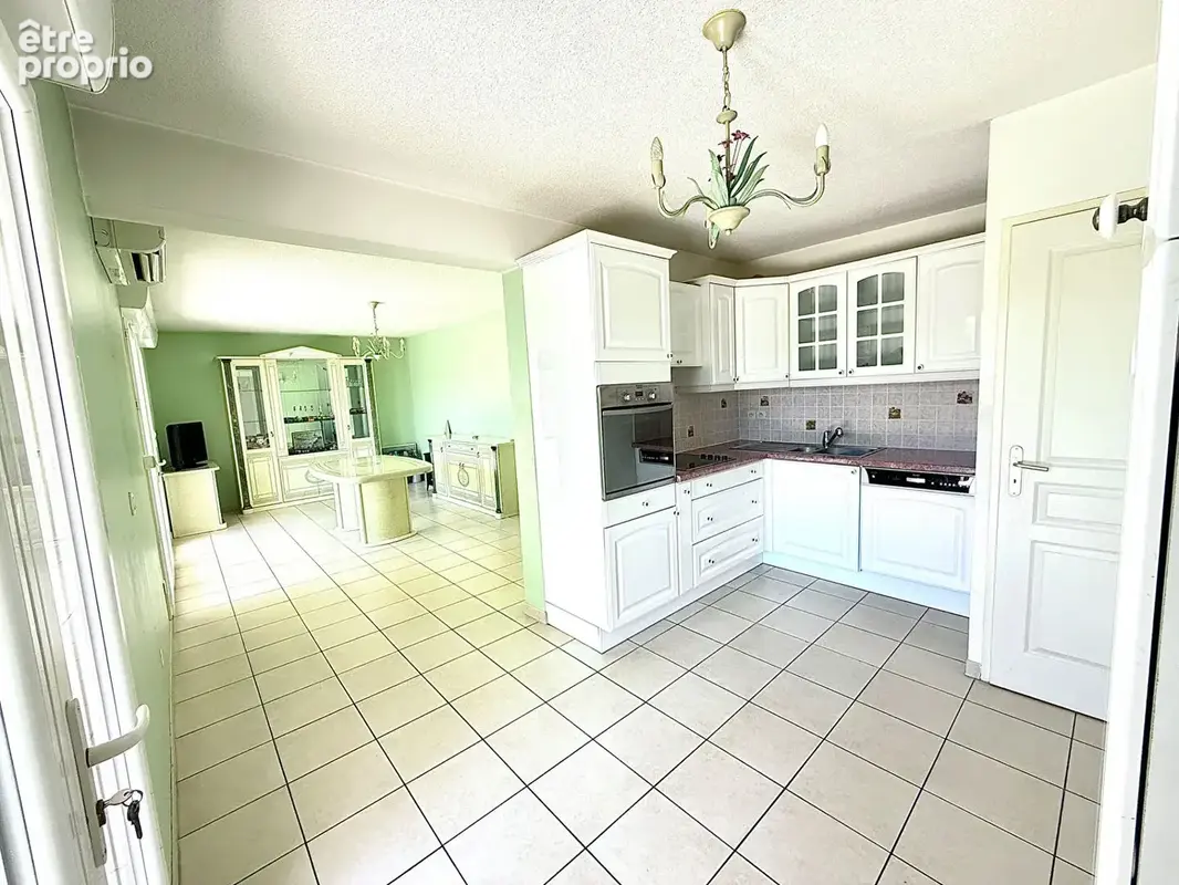 Appartement en rez-de-jardin avec terrasse et place de parking privative63,65 - photo 4