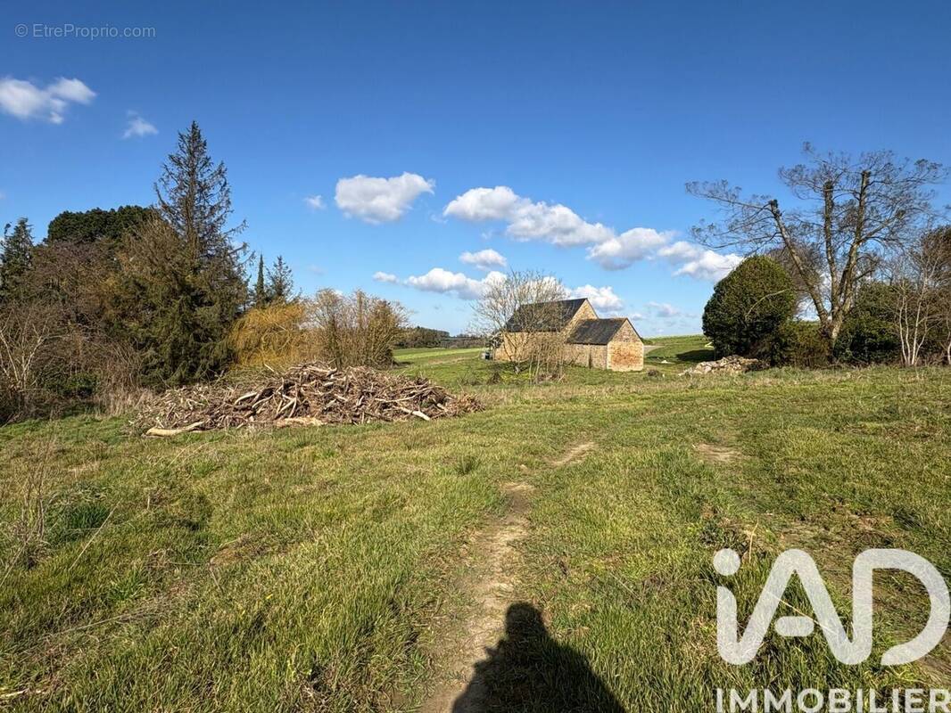 Photo 1 - Terrain à CAOUENNEC-LANVEZEAC
