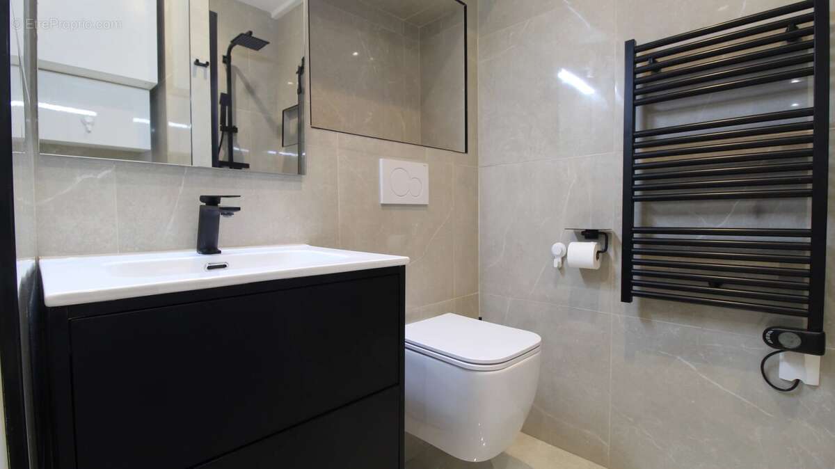 Studio optimisé en 2 pièces de 27 m² entièrement rénové - photo 8