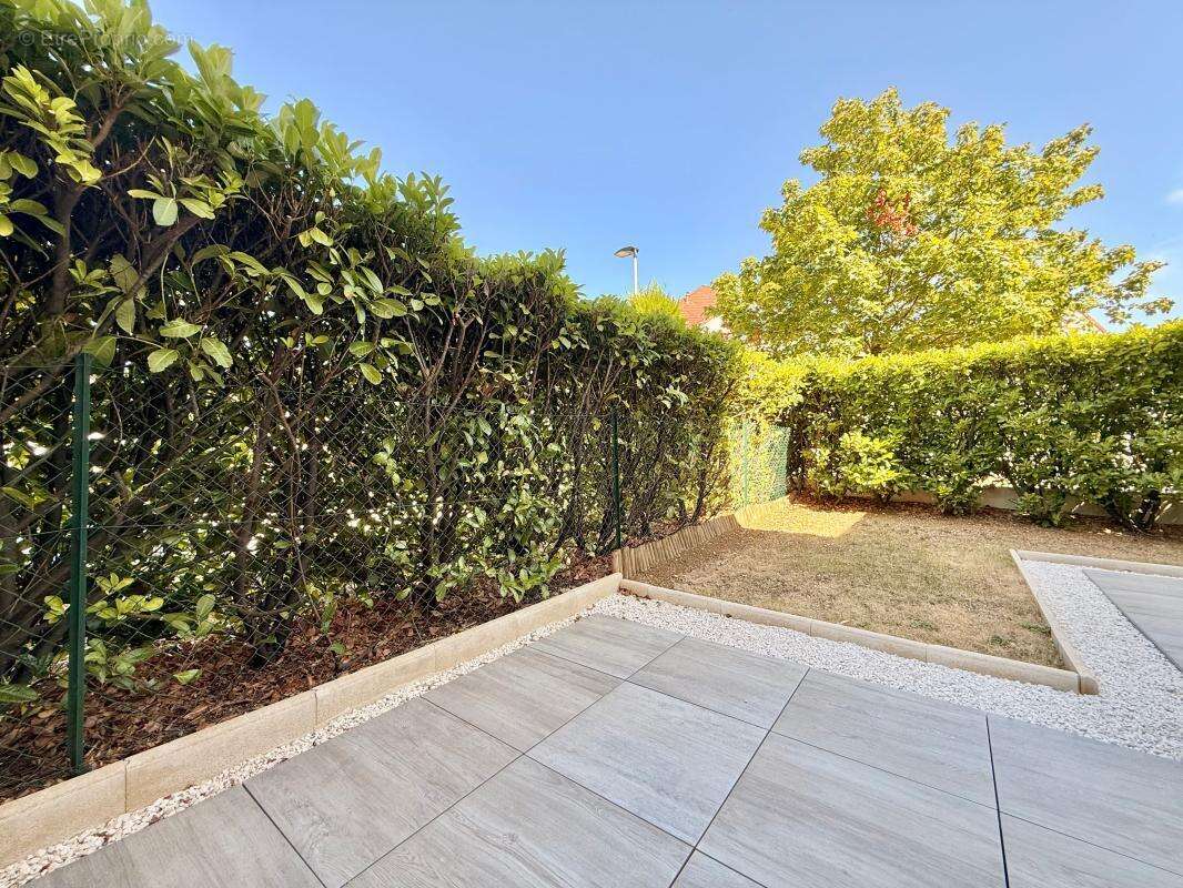 Appartement T3 avec jardin privatif et place de stationnement - photo 12