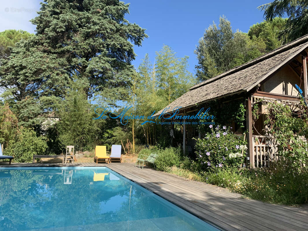 ANDUZE, maison en pierres rénovée de type F6 avec piscine et chambre indépendante sur un terrain arboré de 178 - photo 2