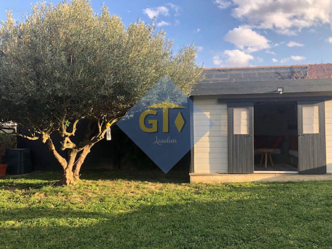 Maison à LAUDUN-L'ARDOISE