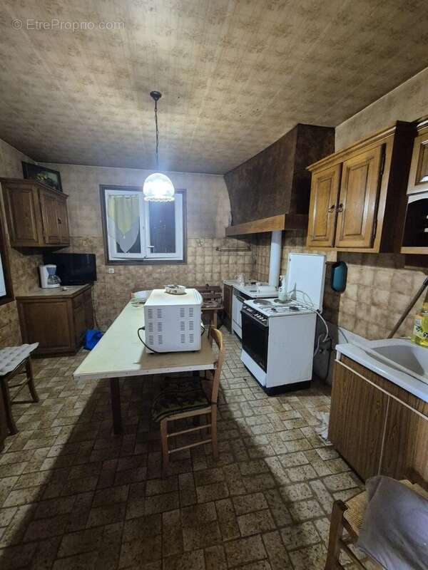 Maison de plain pied avec sous sol semi enterré - photo 5