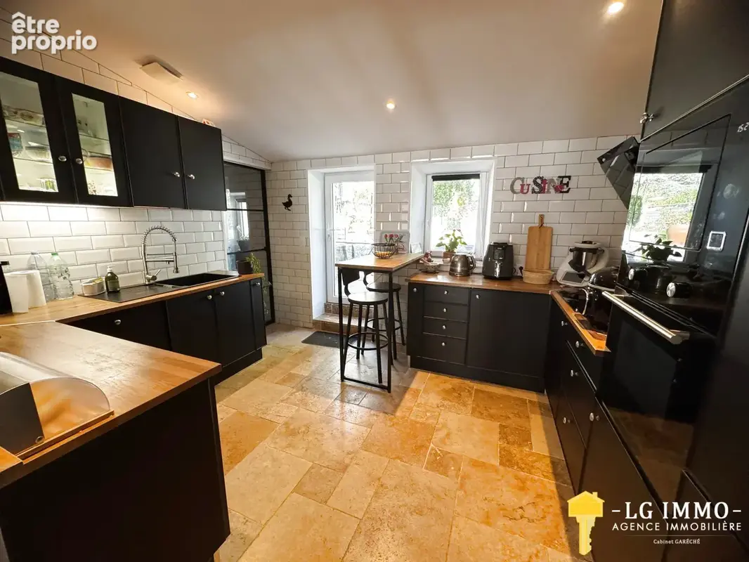 Maison de plain-pied avec jardin et garage en centre ville - photo 4