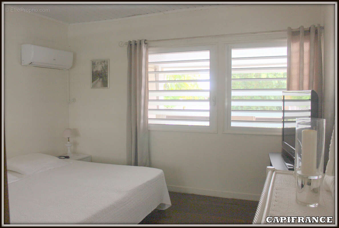 A vendre a kourou (97310) une magnifique maison en bois t5 de 106 m² avec 2 maisons t2 independantes - terrain de 775 m² - au pr - photo 9