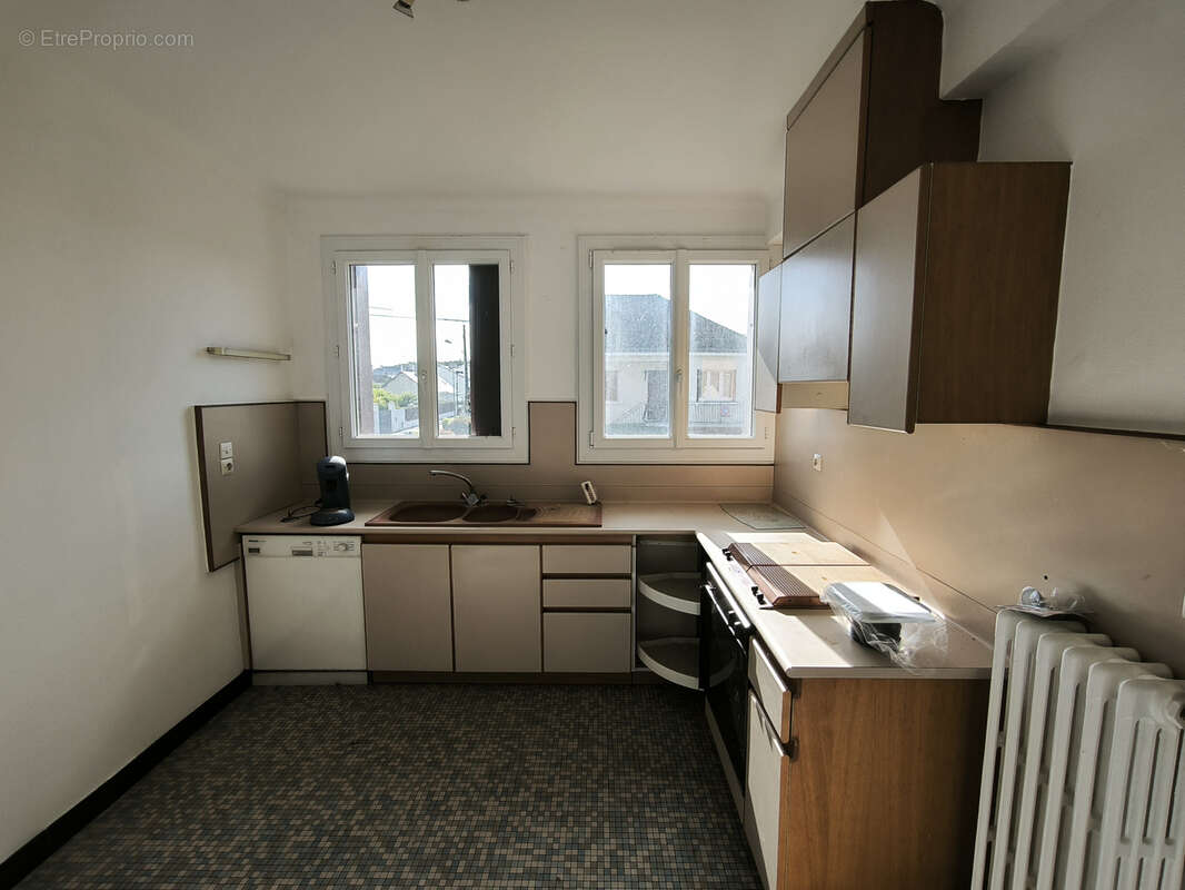 Maison sur sous-sol de 118 m2 avec jardin de 1076m2 en plein centre - photo 6