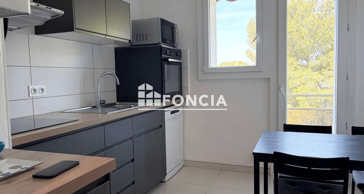 Appartement f3 proche des arceaux avec cave et parking - photo 4
