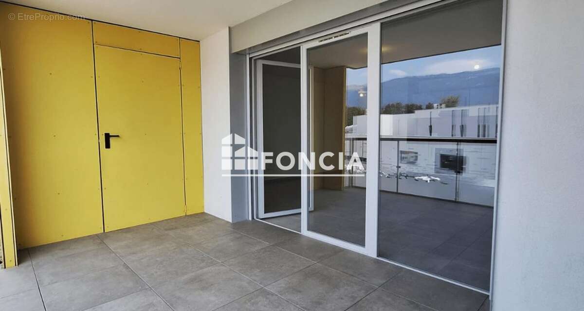 St Genis Pouilly. Ce charmant appartement de type 3 offre une superficie de 71 m2 et dispose d'une terrasse 2 place en sous -sol - photo 2