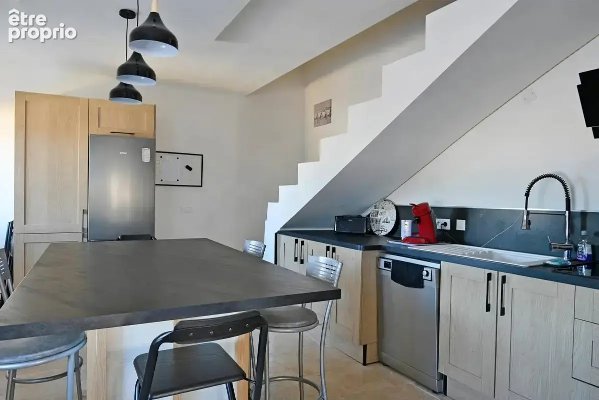 Maison de 5 pièces de 104 m² à Saint-Julien-les-Rosiers - photo 7