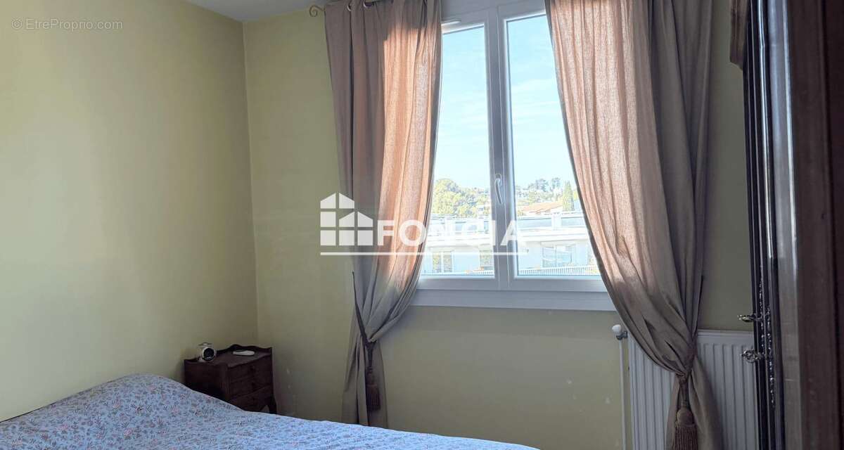 Appartement f3 proche des arceaux avec cave et parking - photo 6