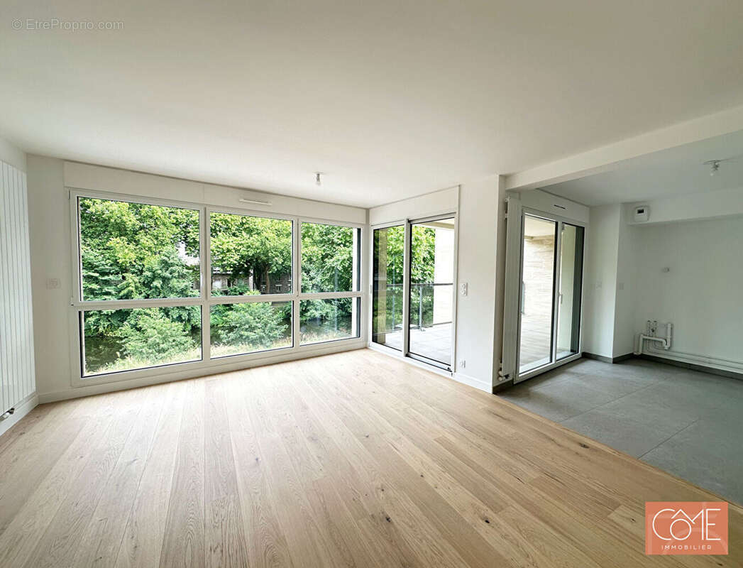 Grand type 3 neuf de standing - 12m² de terrasse - vue canal de l'ille - anatole france - rennes - photo 3