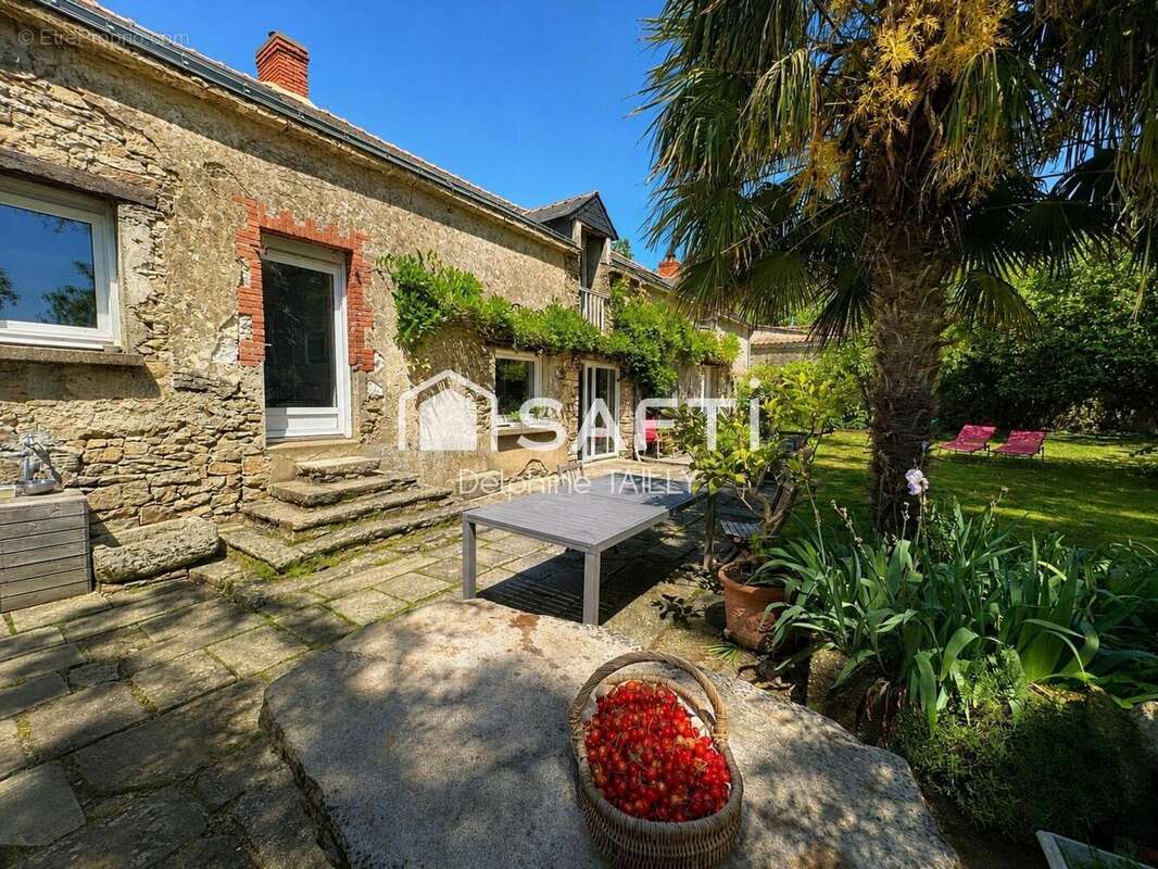 Photo 2 - Maison à SAINT-ETIENNE-DE-MONTLUC