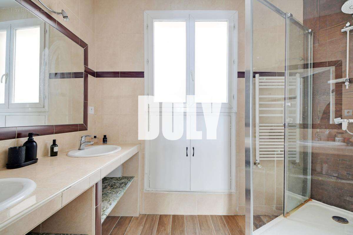 Doly- appartement - boulevard ornano - 75018 - photo 12