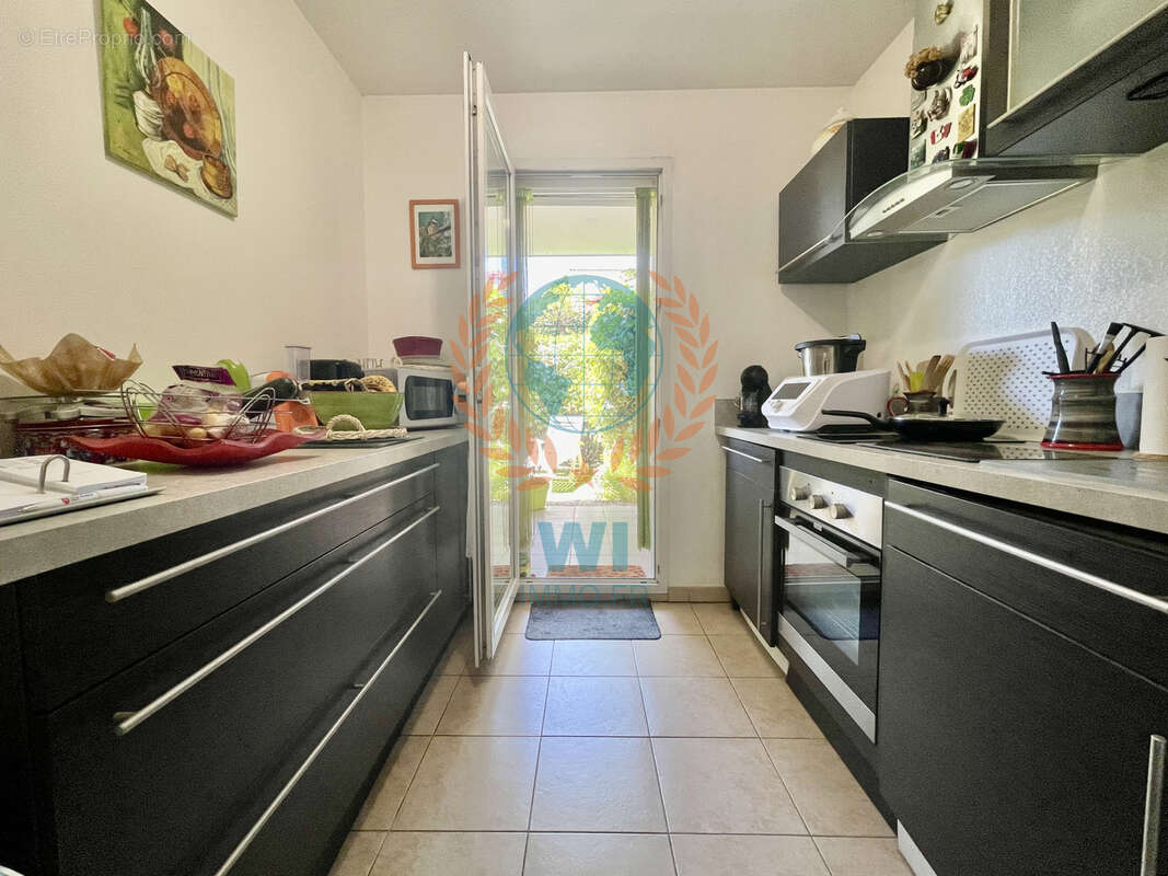 Appartement  en rez-de-jardin avec piscine et garage - photo 4