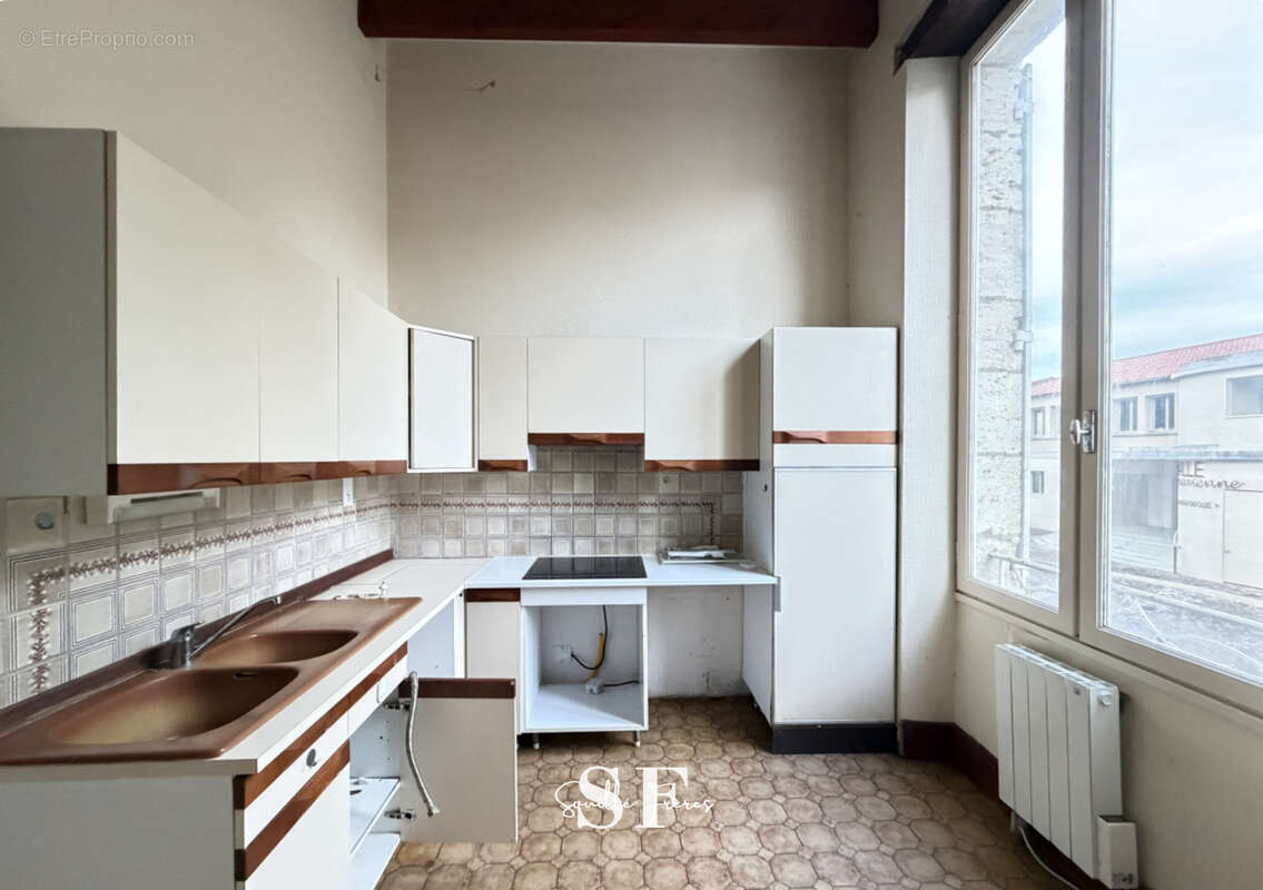 Rive gauche, immeuble de caractere appartement et local commercial - photo 7