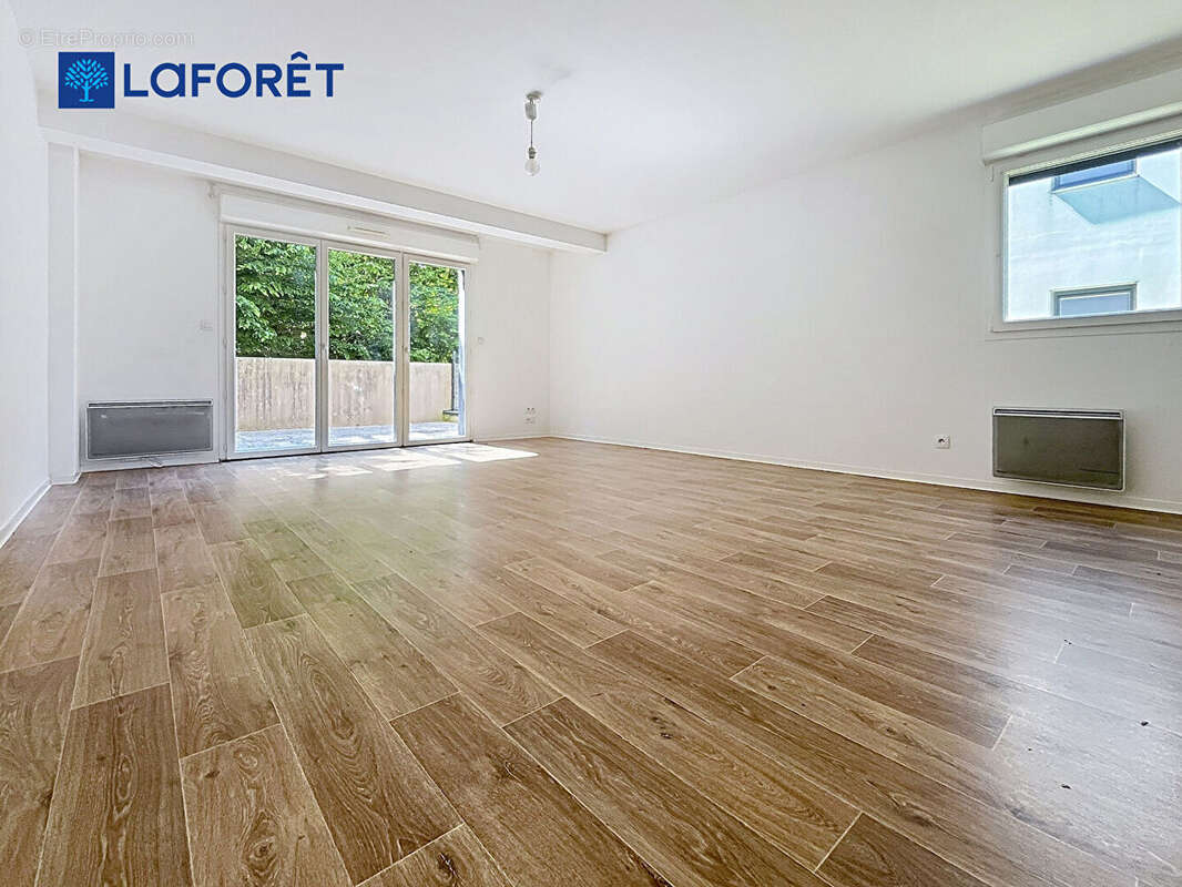 Au Centre de Guidel, Appartement 68m²,  2 chambres, terrasse, jardin, 2 stationnements - photo 5