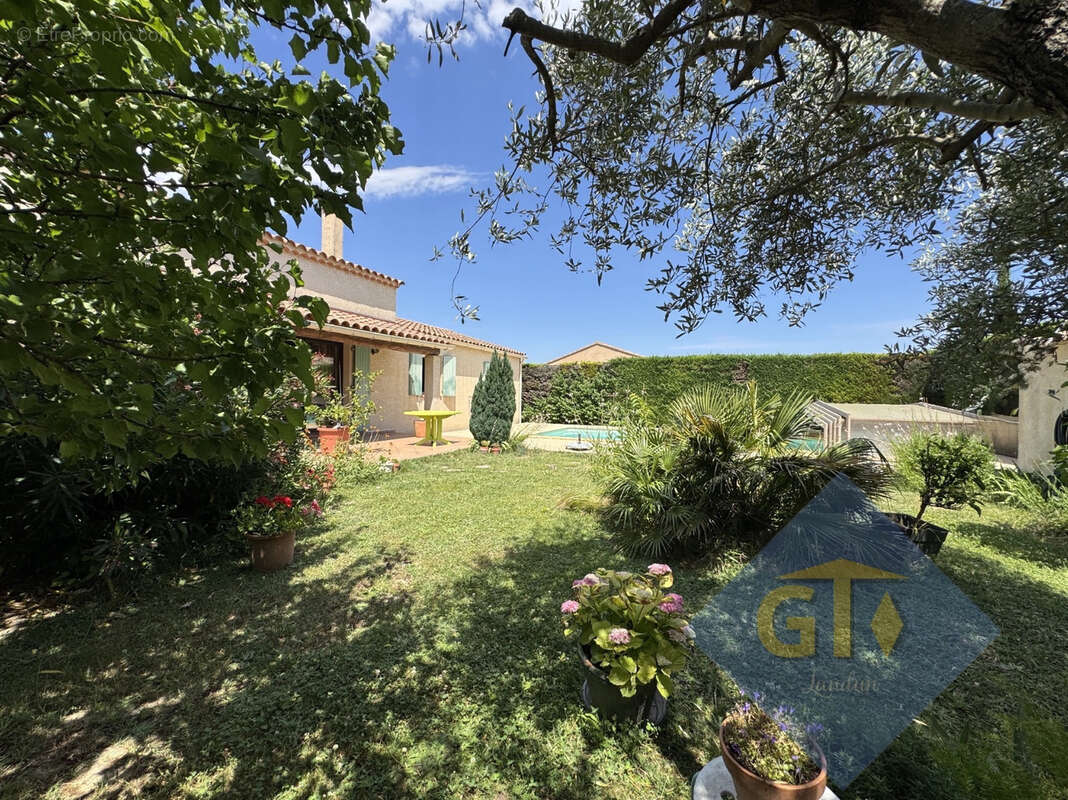 Maison à LAUDUN-L'ARDOISE