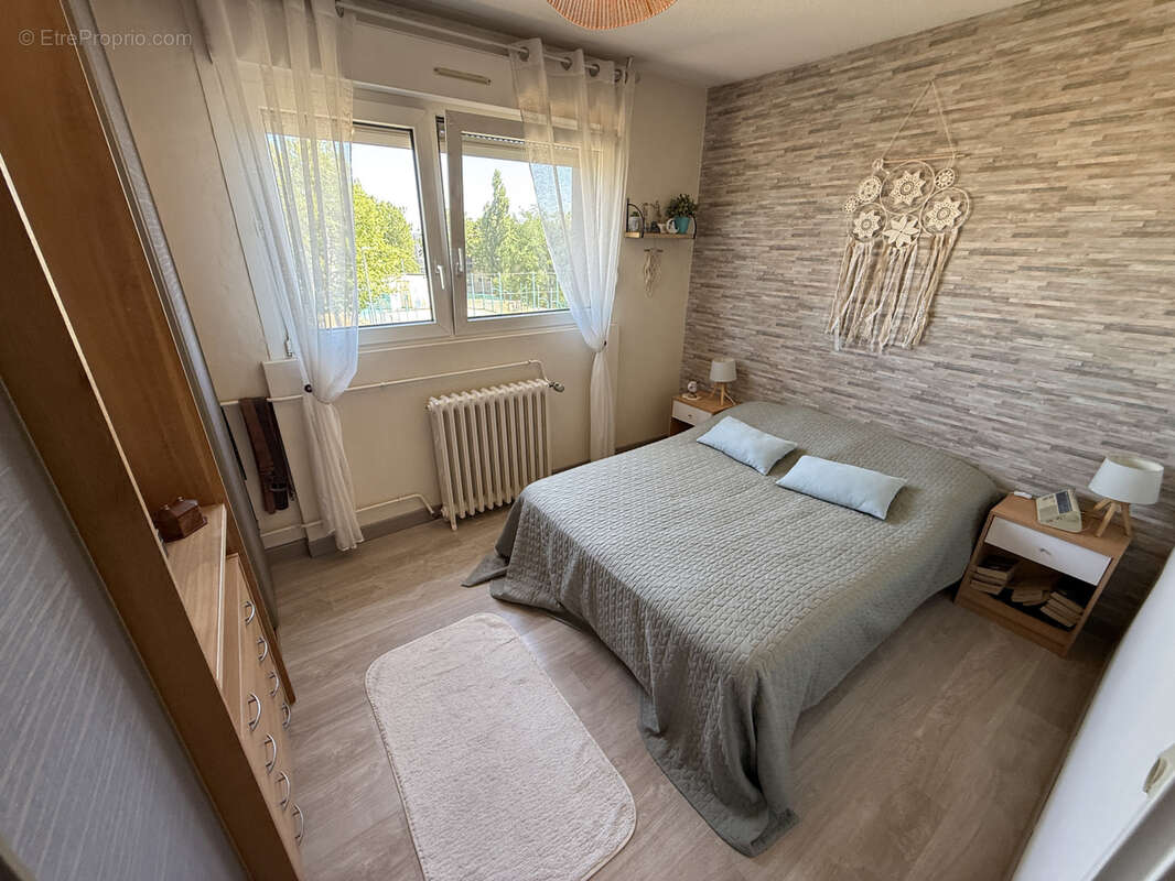 Appartement 5 pièces de 82,20 m2 avec une petite véranda, un balcon et un garage - photo 8