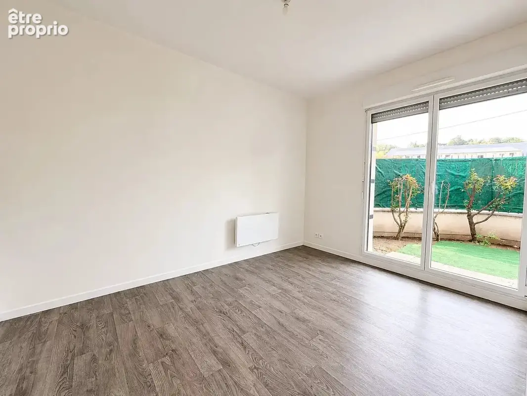 Appartement F3 de 62 m² avec jardin privatif et place de parking sécurisée - photo 7