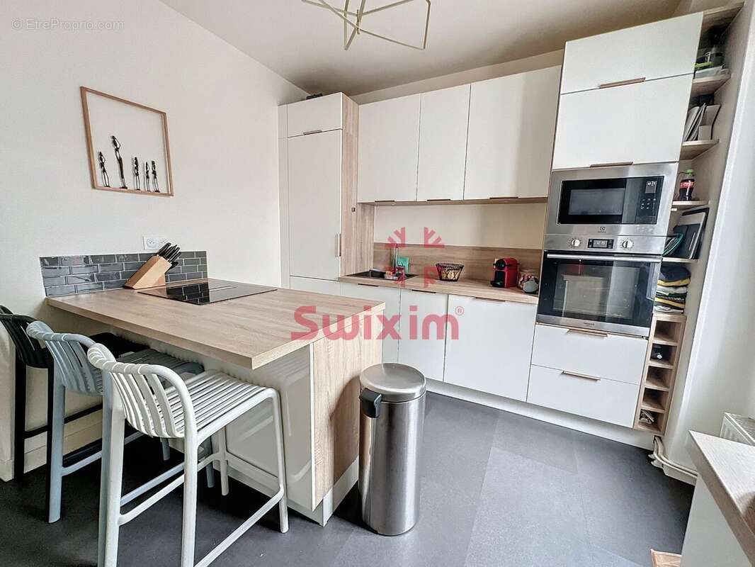 3472849_866788_photo_4.jpg - Appartement à PARIS-20E