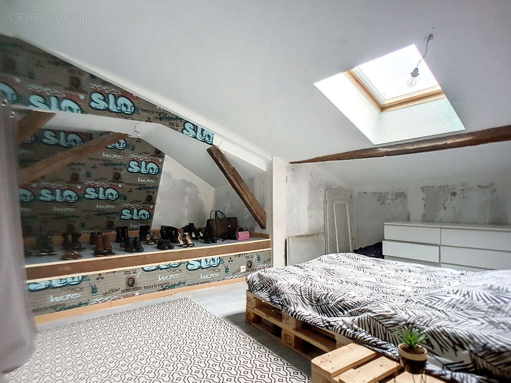 Immeuble de rapport 1 local commercial et 3 appartements avec rapport locatif annuel attendu de 18.000 € - photo 8