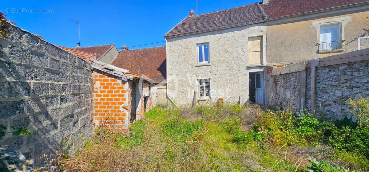Face arrière jardin - Maison à COULOMMIERS