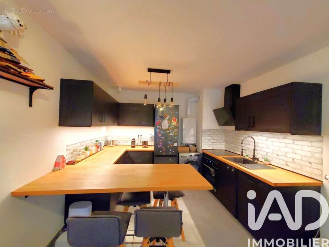 Photo 2 - Appartement à VOISINS-LE-BRETONNEUX