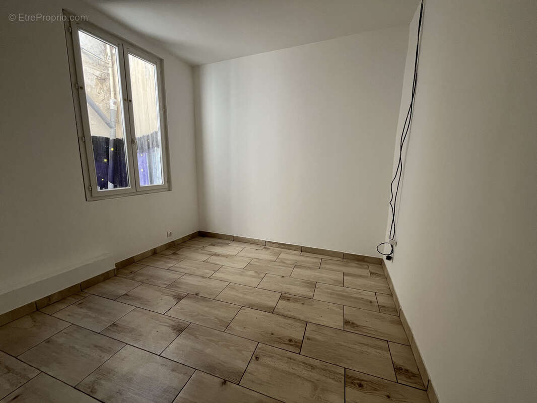 Appartement T2 proche centre-ville - photo 4