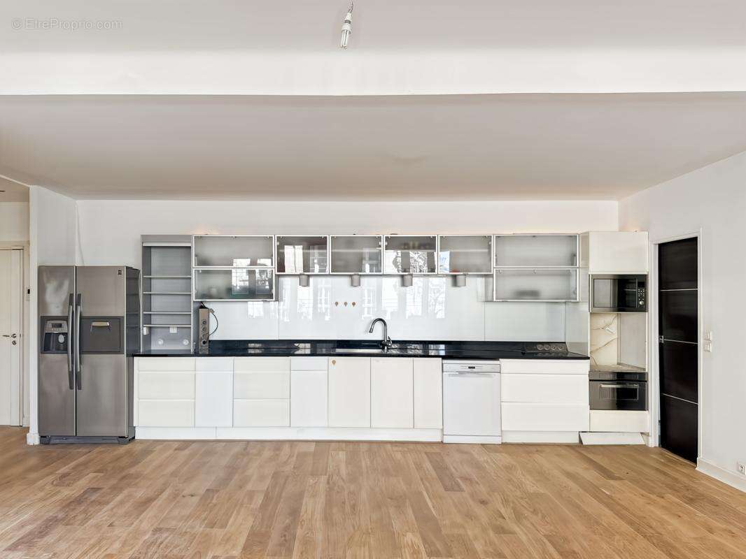 Appartement 106 m² à Paris-9e  - photo 7