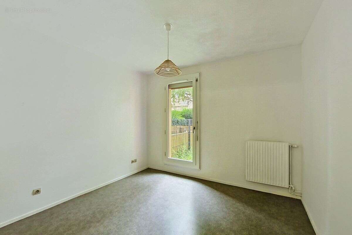 Appartement T2 en rez de jardin - photo 2
