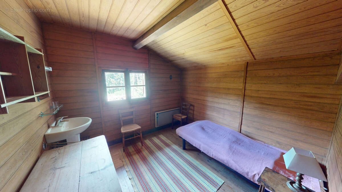 Chalet en bois sur sous sol et terrain attenant boisé - photo 15