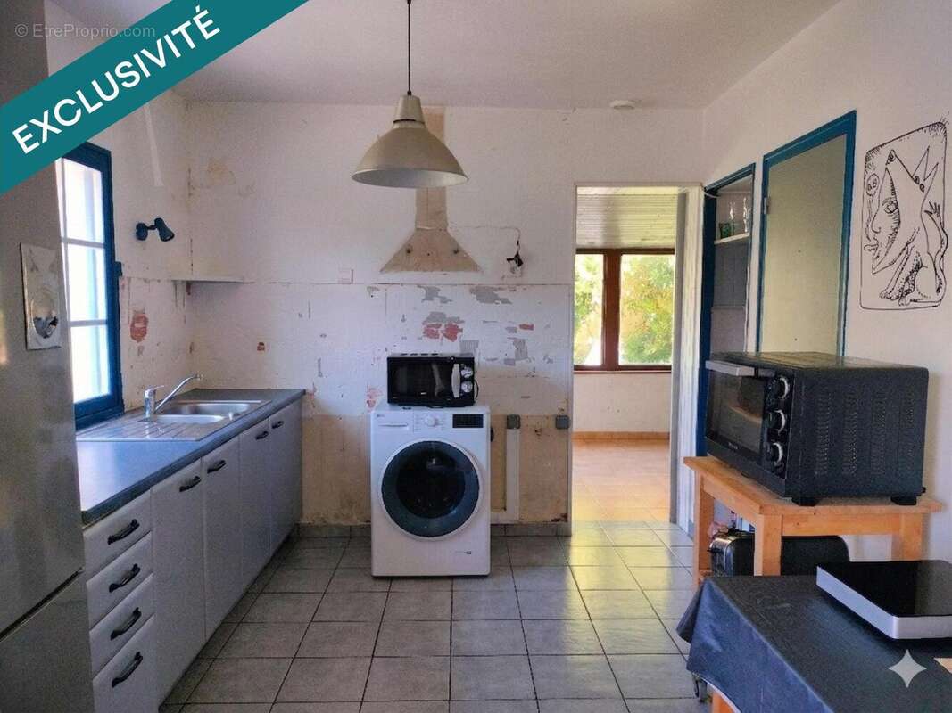 Photo 2 - Maison à PLUGUFFAN