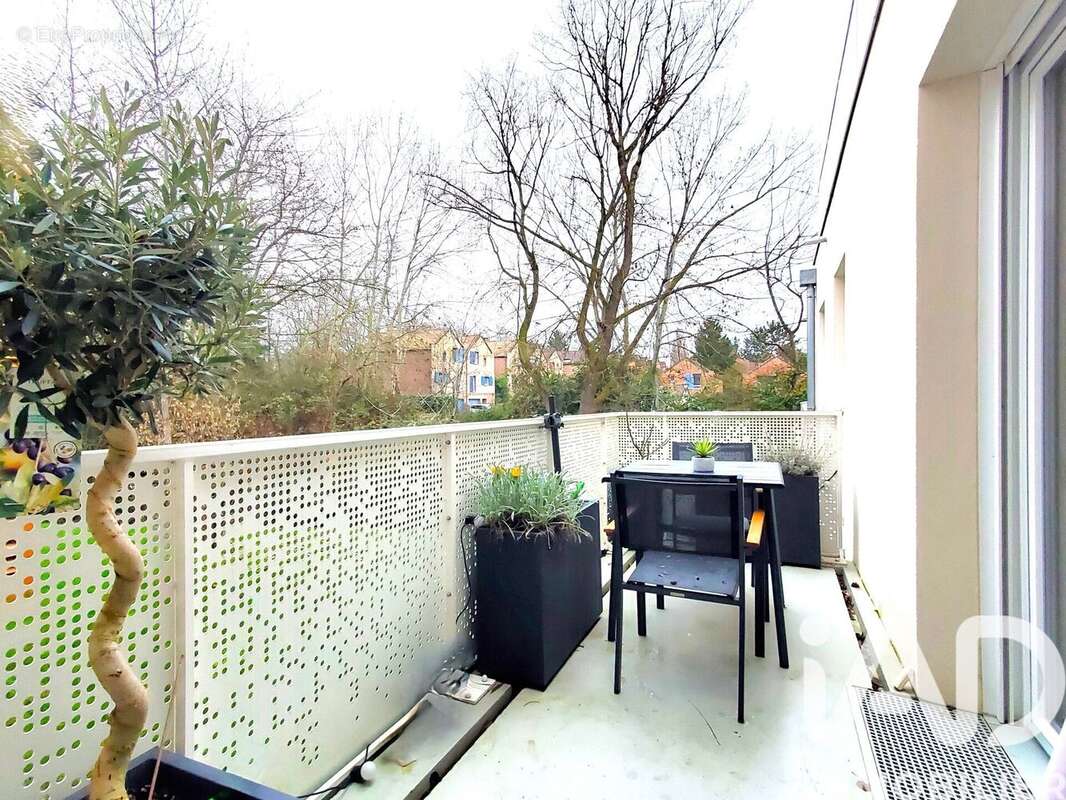 Photo 2 - Appartement à VOISINS-LE-BRETONNEUX
