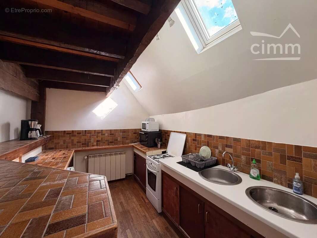 Immeuble de rapport avec local commercial loué et deux appartements - photo 3