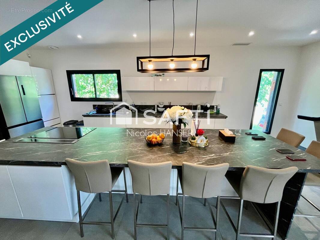 Photo 1 - Maison à SAINT-JULIEN-LES-ROSIERS