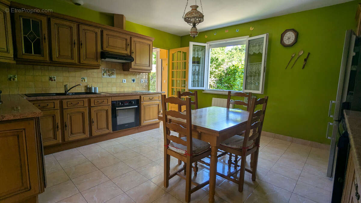 Maison de plain-pied 128 m² avec jardin à Val-de-Reuil 4 chambres - photo 4