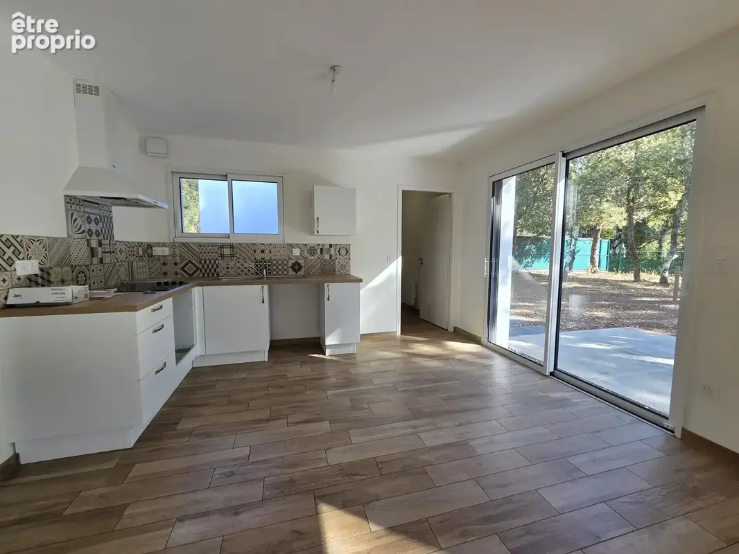 3 chambres + garage sur un beau terrain boisé de 800 m2 - photo 4