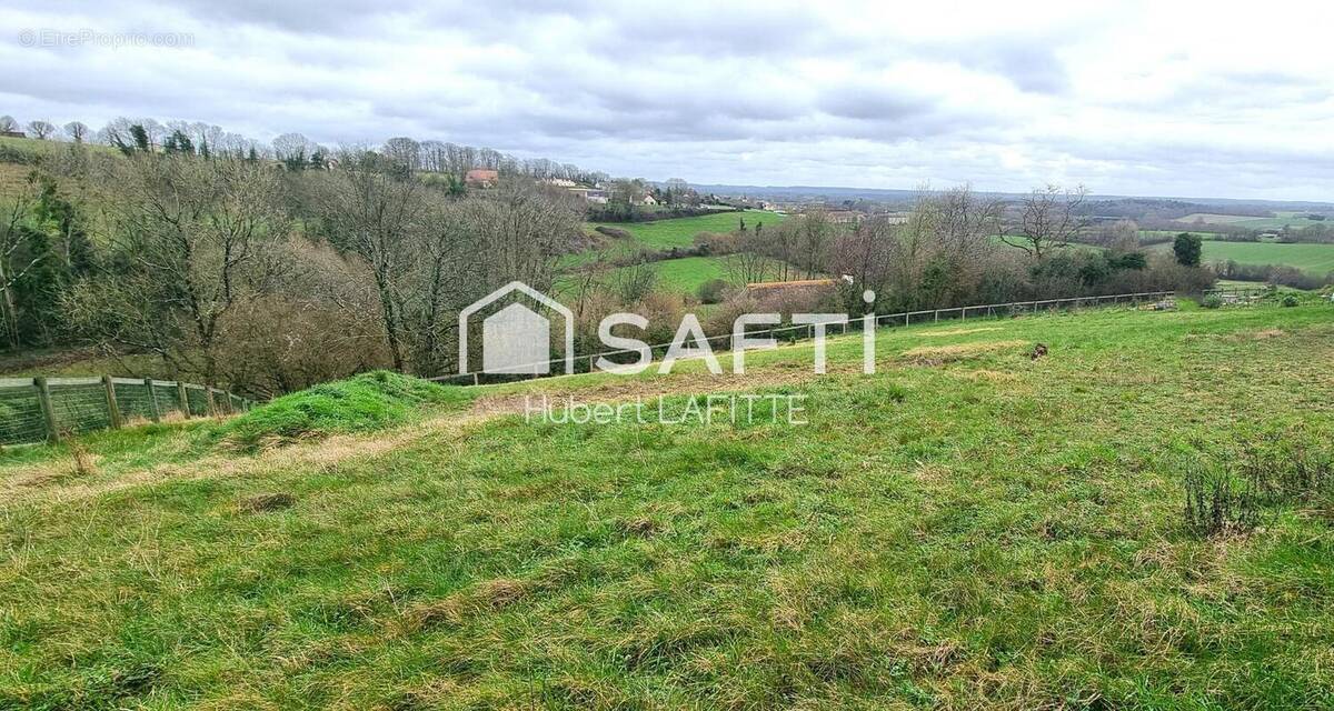 Photo 1 - Terrain à SAINT-LANGIS-LES-MORTAGNE