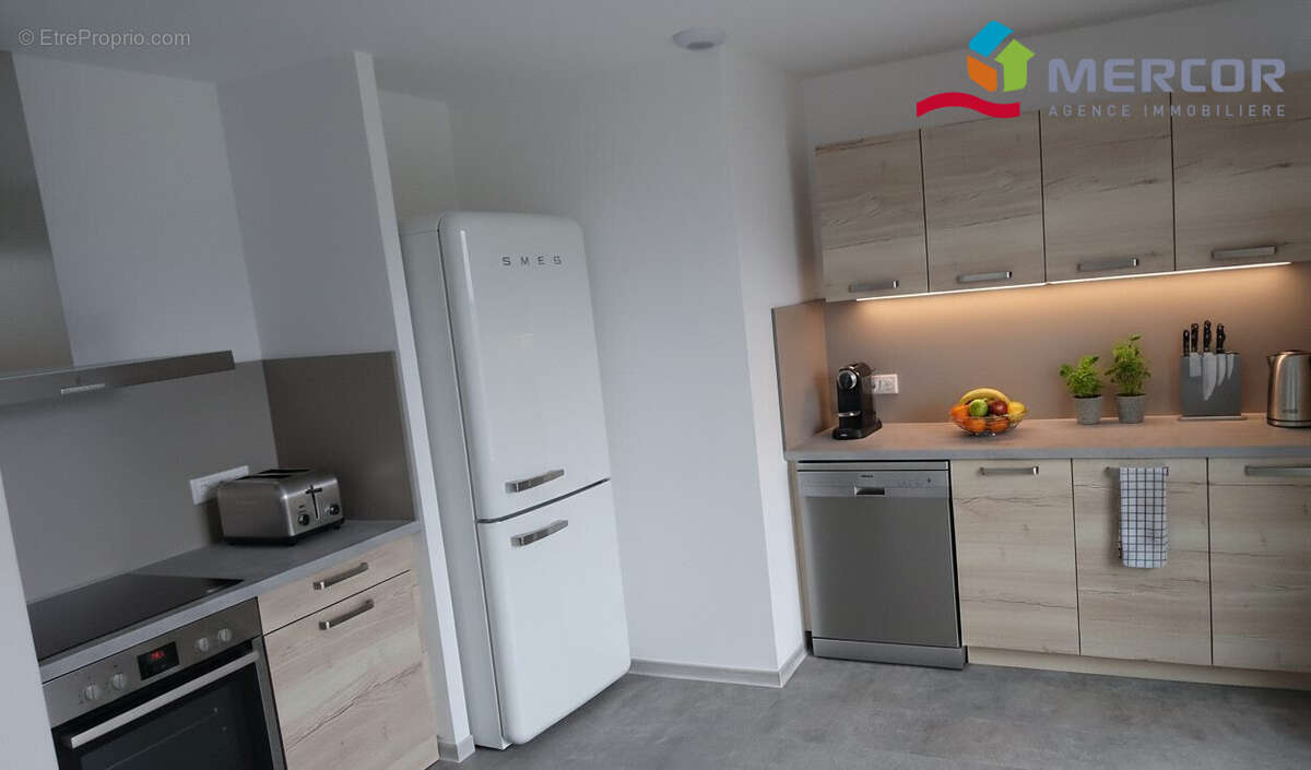 Cuisine ouverte sur la salle à manger - Appartement à NEUGARTHEIM-ITTLENHEIM
