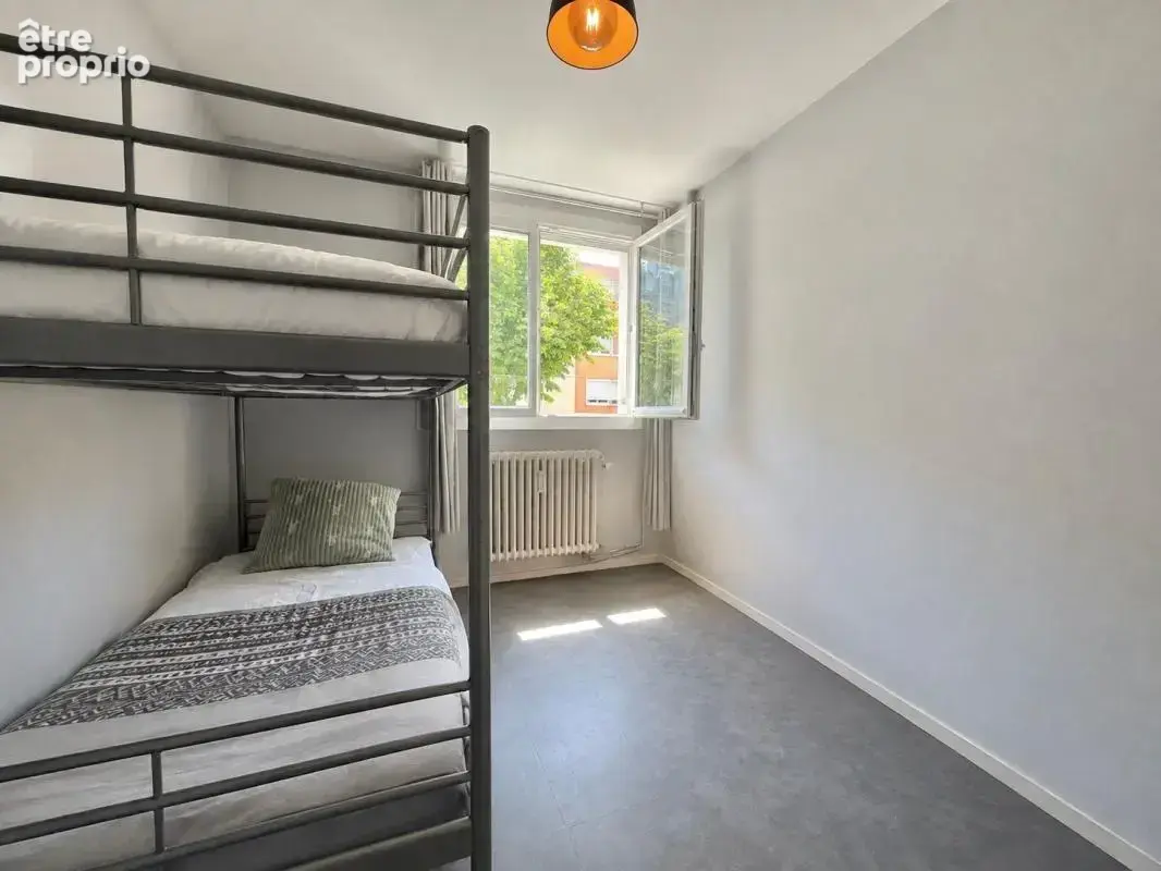 Appartement T4, 3 chambres, en rez-de-chaussée, avec cave en sous-sol - photo 7
