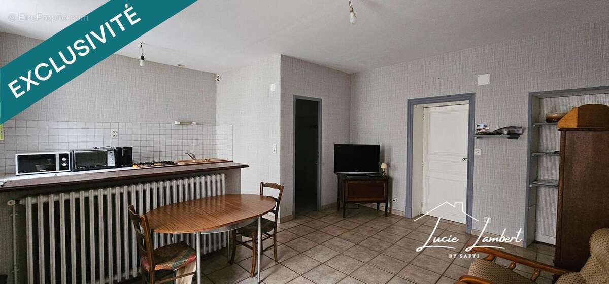 Photo 4 - Maison à LE BREUIL-SUR-COUZE