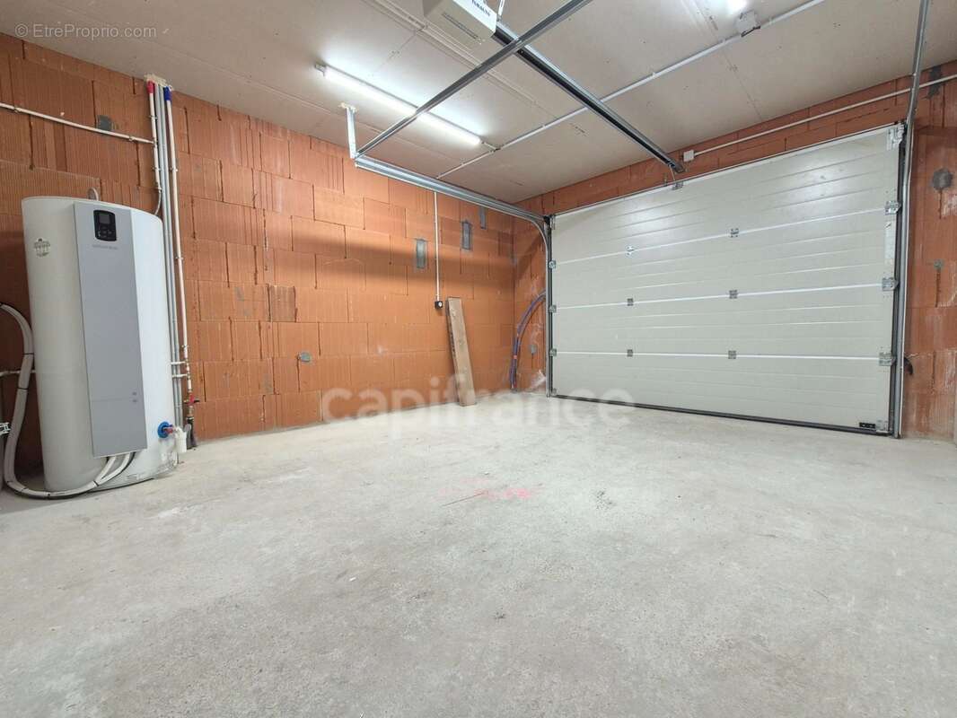 Maison de plain-pied à vendre - 4 pièces CHAILLEVETTE (17) - Garage - photo 26
