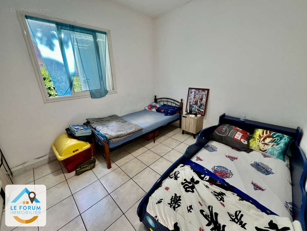 Saint joseph 97480 - villa f3 + bureau -  varangue ouverte - terrain plat et cloture - secteur recherché - photo 4