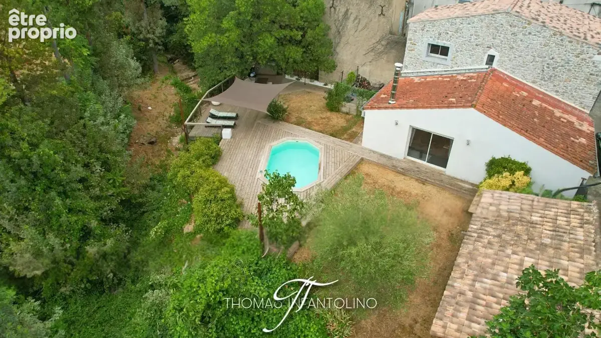 En exclusivite - maison en pierre - jardin - piscine - garage - climatisation - faible taxe foncière - photo 17
