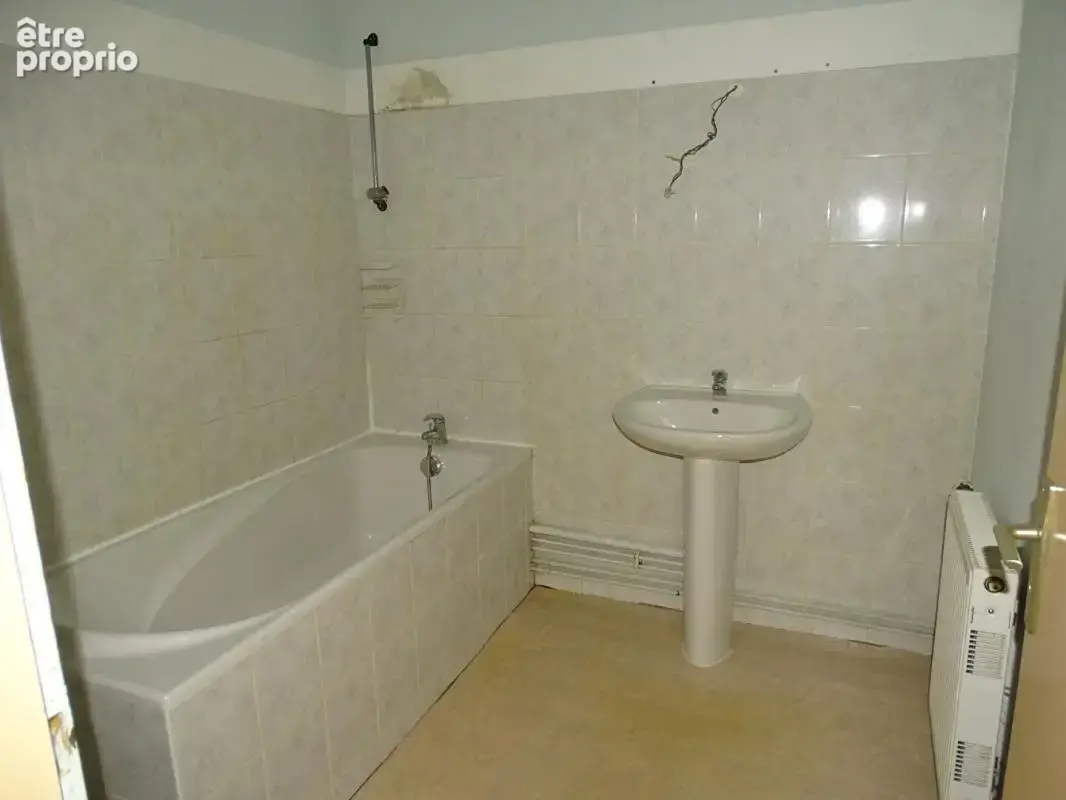 Immeuble comprenant 4 appartements + caves, jardin et parkings - photo 9