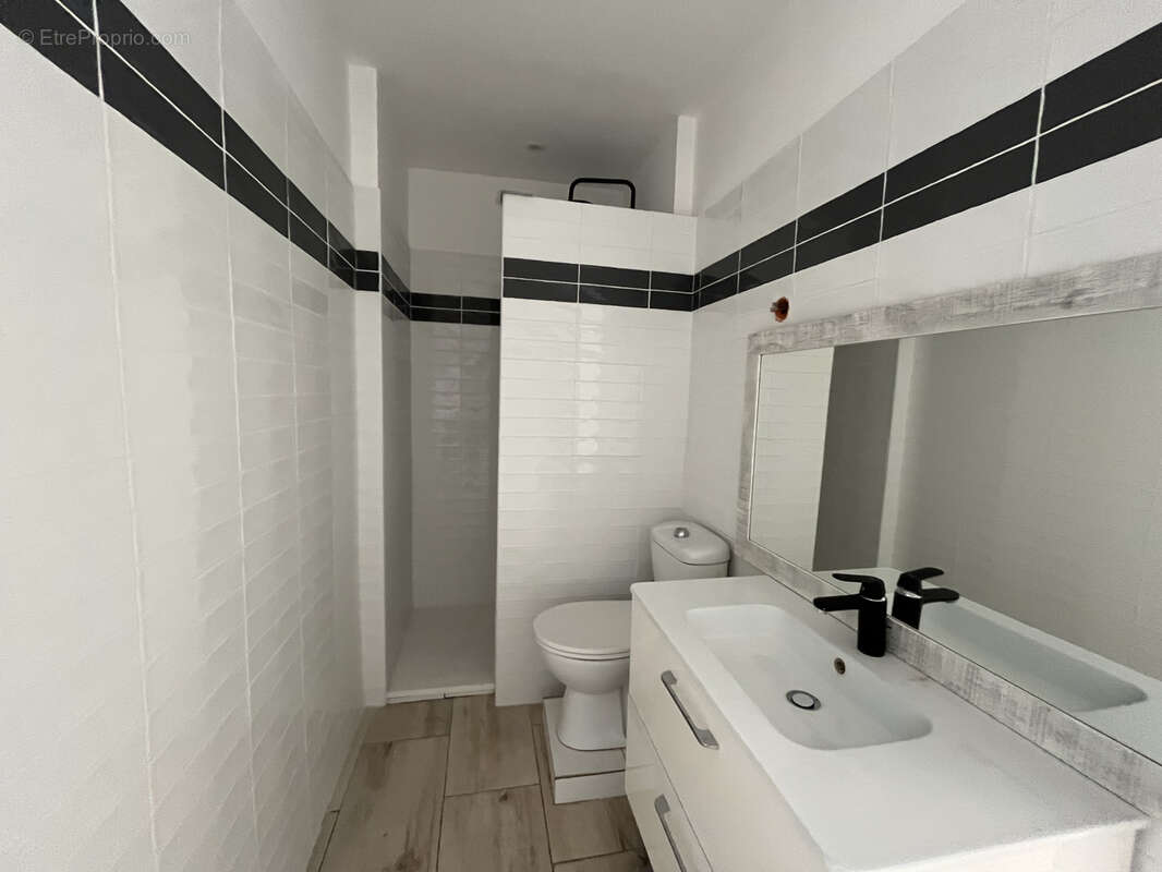 Appartement T2 proche centre-ville - photo 5