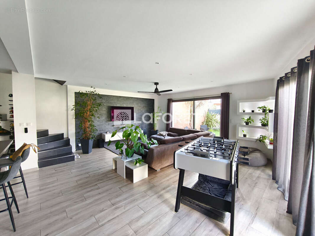 Maison de plus de 100 m², située dans un quartier calme et recherché, à proximité du centre-ville. - photo 4