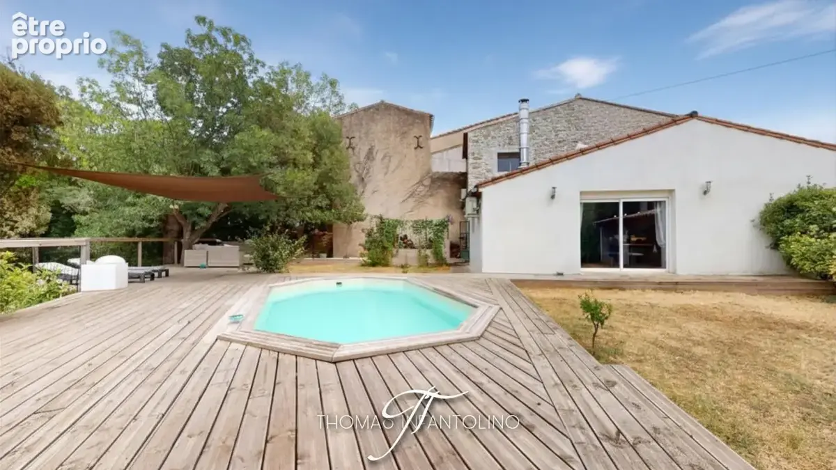 En exclusivite - maison en pierre - jardin - piscine - garage - climatisation - faible taxe foncière - photo 9